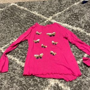 Pink long sleeve with gold and black butter flies